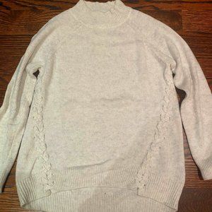 White sweater with braided detailing